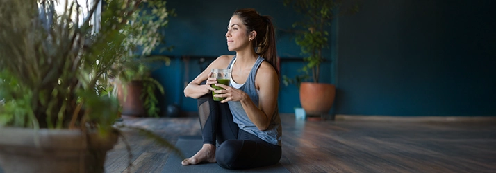 Chiropractic Anchorage AK Woman Drinking Green Juice