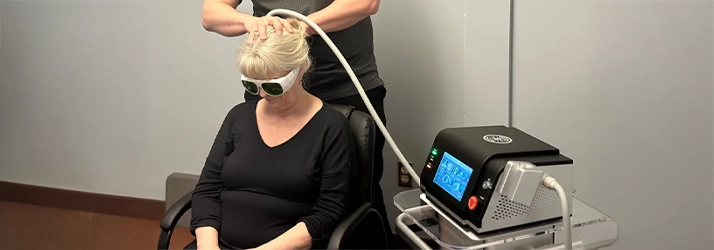 Chiropractic Anchorage AK Woman Receiving Laser Therapy