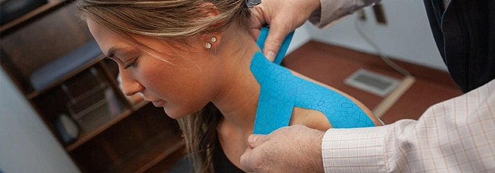 Chiropractic Anchorage AK Woman With Kinesiology Tape On Shoulder